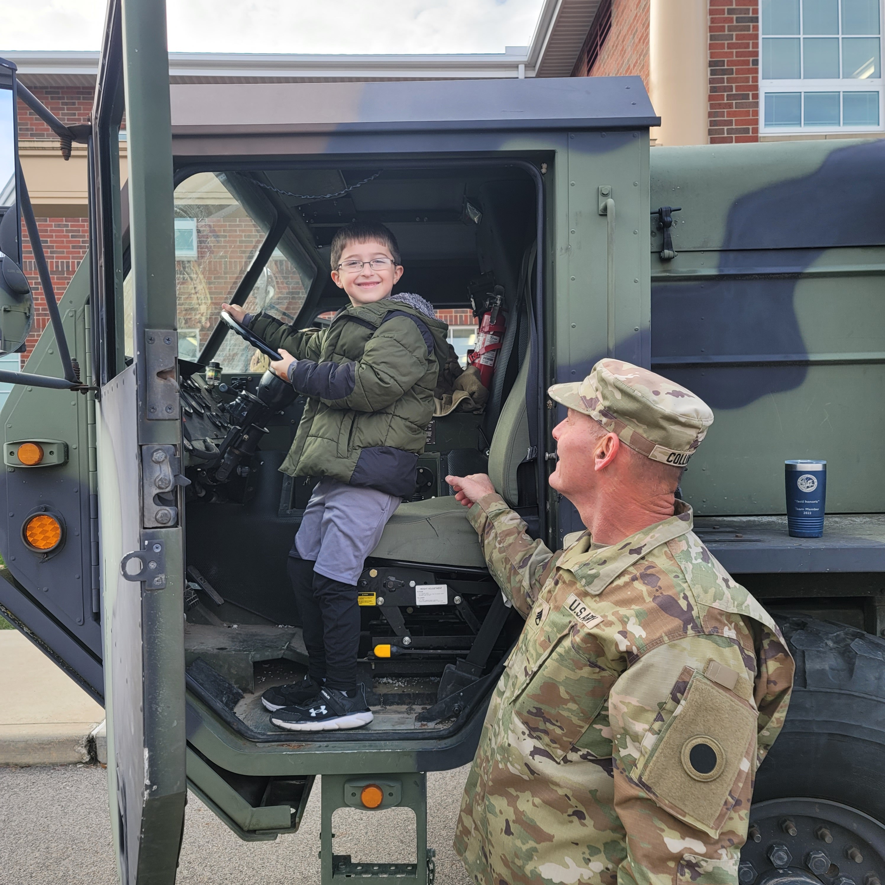 Student in Driver Seat of Military Vehicle